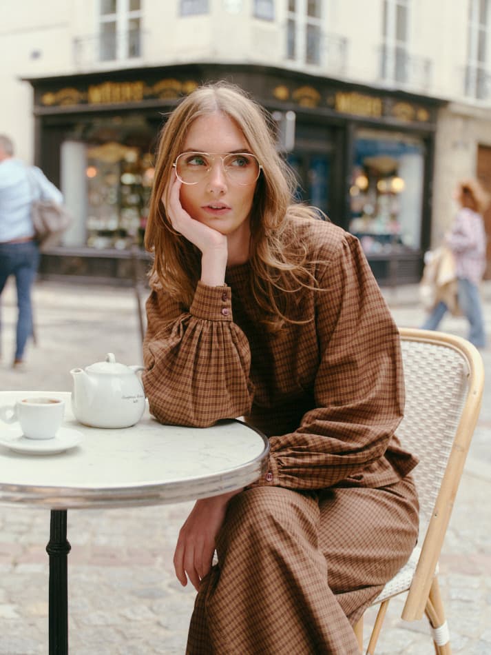 Rouri fashion editorial at a Paris café